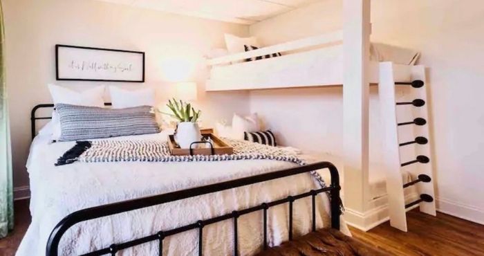 Live the Lake Life A queen size bed next to a set of built-in bunk beds