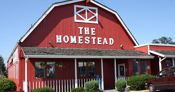Entrance to The Homestead, a red barn-like building
