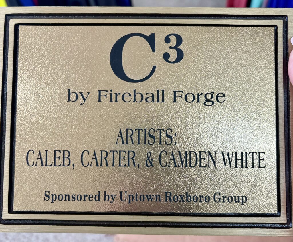 Metal Sculpture plaque for the Roxboro Savings Centennial Park for artists Carter, Caleb & Camden White